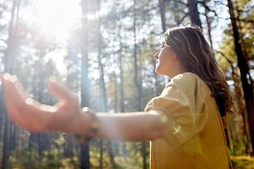 Image showing woman or witch performing magic ritual in forest