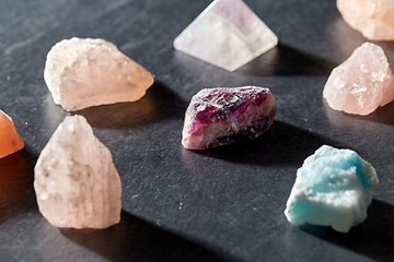 Image showing quartz crystals and gem stones on slate background