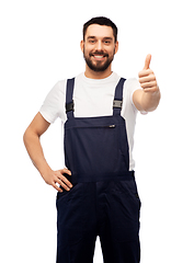 Image showing smiling male worker or builder showing thumbs up