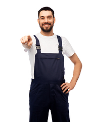 Image showing smiling male worker or builder pointing to camera