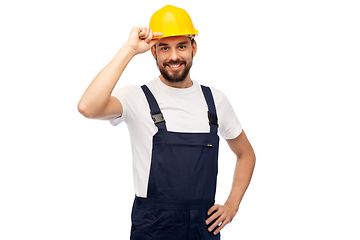 Image showing happy smiling male worker or builder in helmet