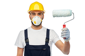 Image showing worker or builder in respirator with paint roller