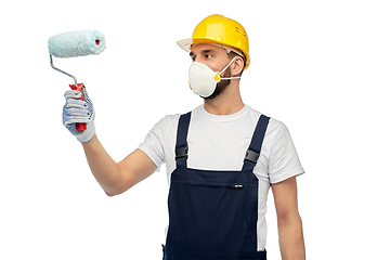Image showing worker or builder in respirator with paint roller