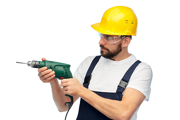 Image showing male worker or builder in helmet with drill