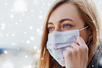 Image showing close up of woman wearing protective medical mask