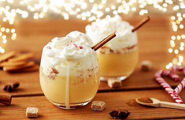 Image showing glasses of eggnog with whipped cream and cinnamon