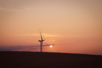 Image showing Windmill in the sunset on a hill