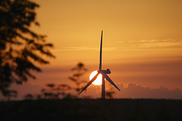 Image showing Windmill in a sunset in a rural summer landscape