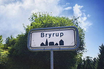 Image showing Bryrup city sign with green trees