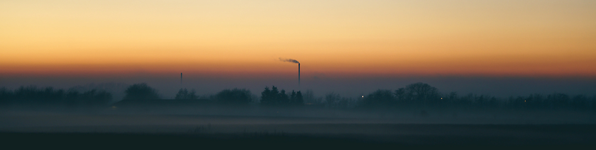 Image showing Panorama scenery with a smoking chimney