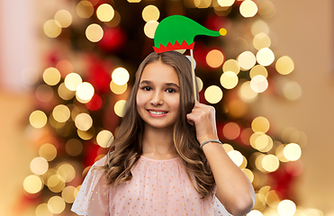 Image showing happy teenage girl with santa helper hat accessory