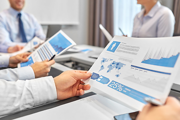 Image showing happy business team with papers meeting at office