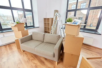 Image showing sofa and corrugated boxes with stuff at new home