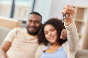 Image showing happy couple with house key moving to new home