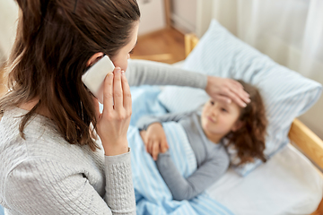 Image showing ill daughter and mother calling on phone at home