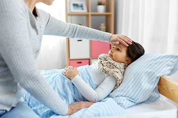 Image showing mother measuring temperature of sick daughter