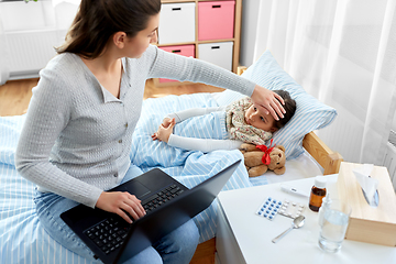 Image showing ill daughter and mother with laptop at home