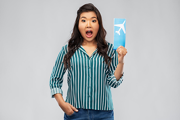 Image showing surprised asian woman with air ticket