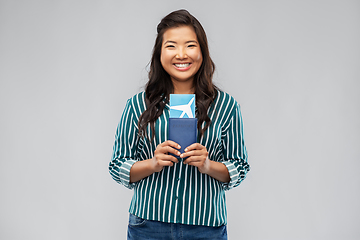 Image showing happy asian woman with air ticket and passport