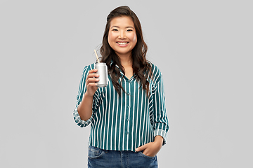 Image showing happy smiling asian woman with can drink