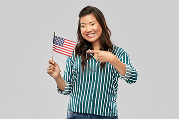 Image showing happy asian woman with flag of america