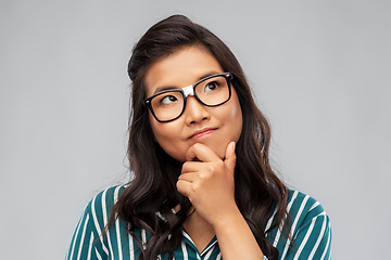 Image showing portrait of thinking asian woman in glasses