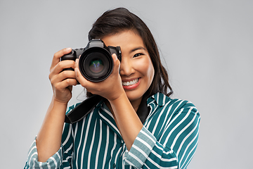 Image showing asian female photographer with digital camera