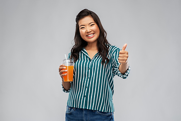Image showing asian woman with juice in plastic cup with straw