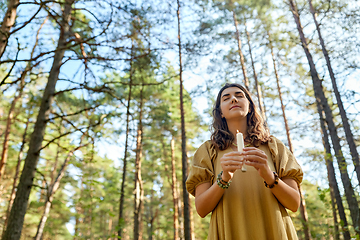 Image showing woman or witch performing magic ritual in forest