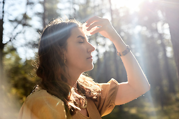 Image showing woman or witch performing magic ritual in forest