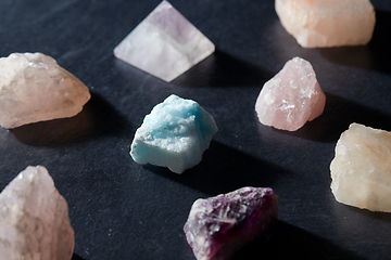 Image showing quartz crystals and gem stones on slate background