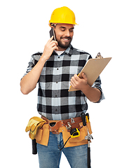 Image showing happy builder with clipboard calling on smartphone