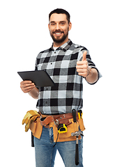 Image showing happy builder with tablet computer and tools