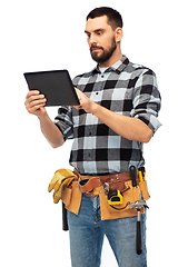 Image showing builder with tablet computer and tools