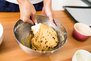 Image showing Stirring the paste in bowl