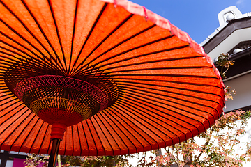 Image showing Japanese red umbrella at autumn