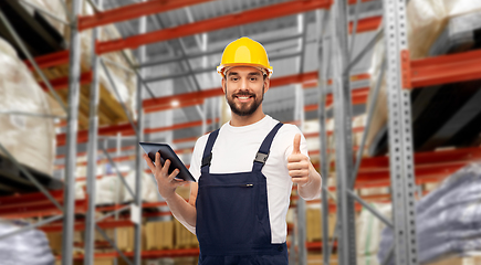 Image showing loader with tablet pc shows thumbs up at warehouse