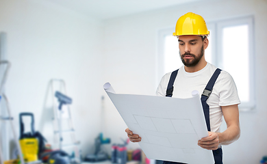 Image showing male worker or builder in helmet with blueprint