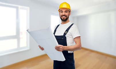 Image showing male worker or builder in helmet with blueprint