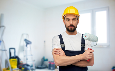 Image showing male worker or builder with paint roller