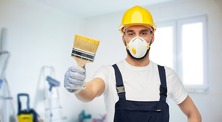 Image showing worker or builder in respirator with brush