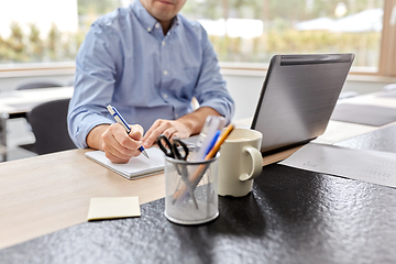 Image showing man with laptop working at home office