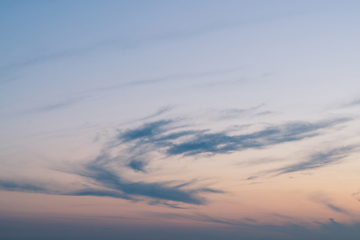 Image showing Cloudy sunset with clouds in the wind