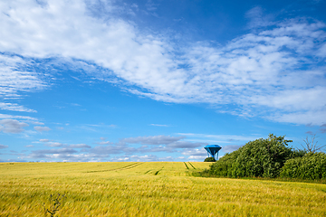 Image showing Rural landscape with a blue water tower