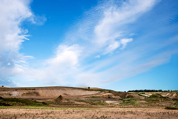 Image showing Gravel pit in a rural landscape with dry flora