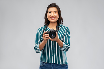 Image showing asian female photographer with digital camera