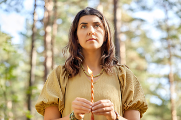 Image showing woman or witch performing magic ritual in forest