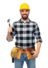 Image showing happy male builder in helmet with hammer