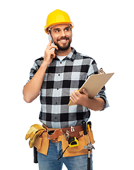 Image showing happy builder with clipboard calling on smartphone