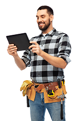 Image showing happy builder with tablet computer and tools
